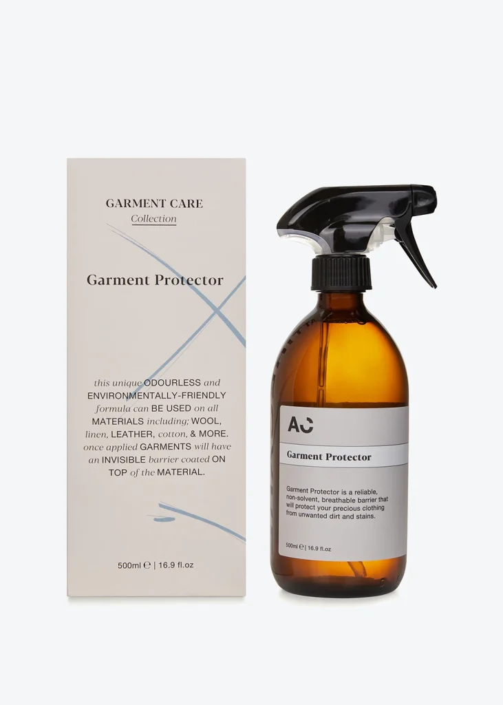 A bottle of carnivore care's cologne spray next to a box.