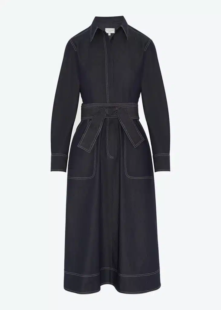 A women's denim shirt dress with a belted waist.