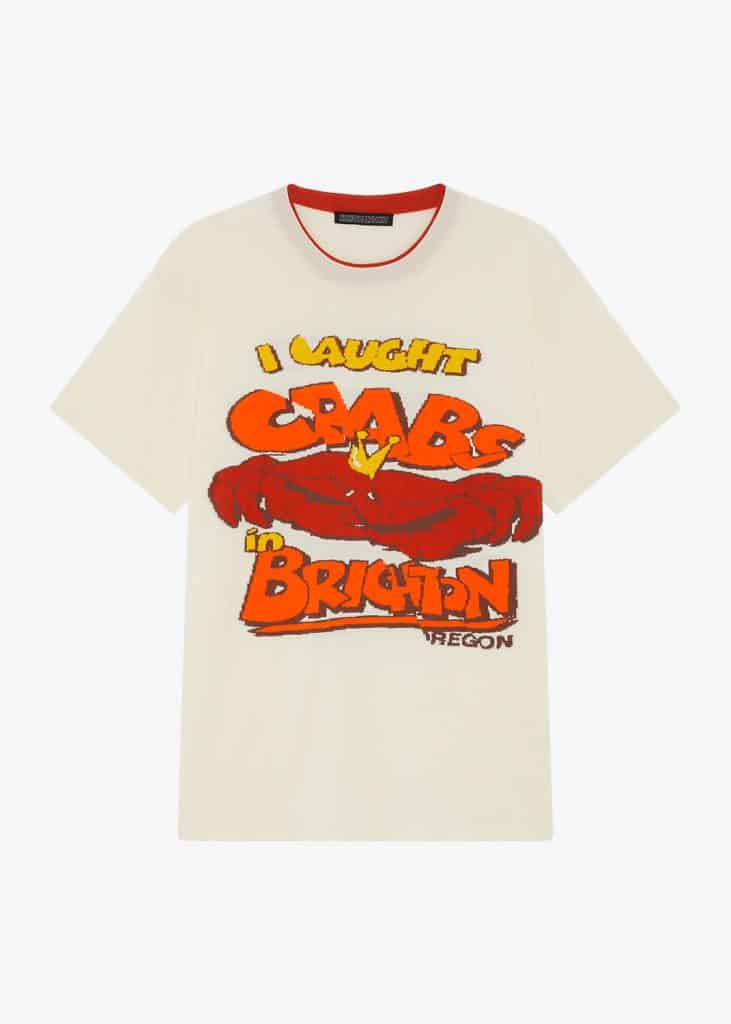 A t-shirt featuring Robyn Lynch's signature design in a flat lay style, with the phrase "I Fought the Crab" boldly printed on it.